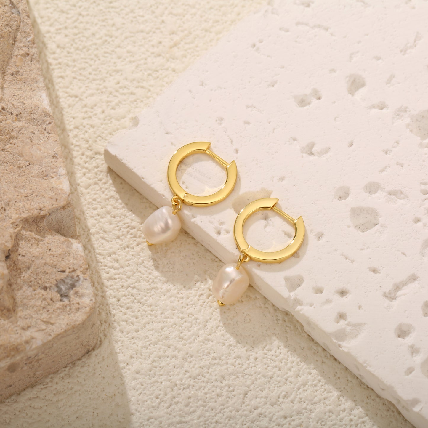 Elegant gold vermeil hoop earrings with dangling freshwater pearls for a timeless look