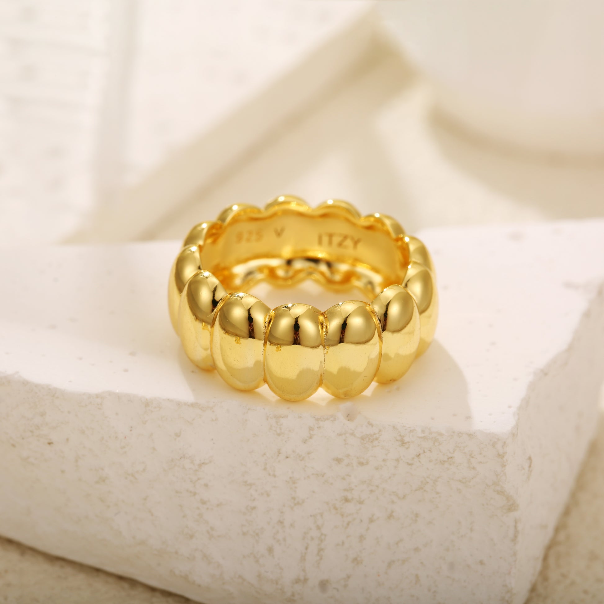 Statement gold vermeil ring with a bold, ribbed design and polished finish