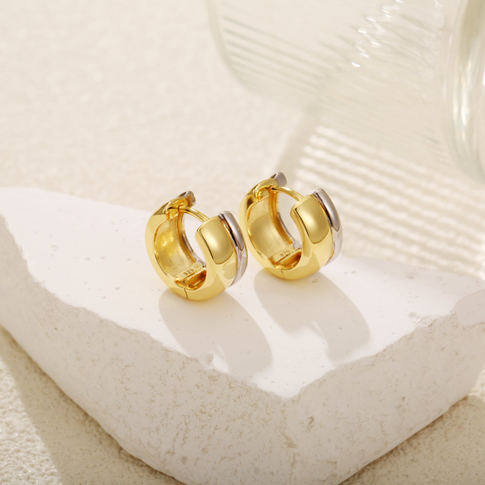 Two-tone gold vermeil huggie earrings with a bold, chunky design