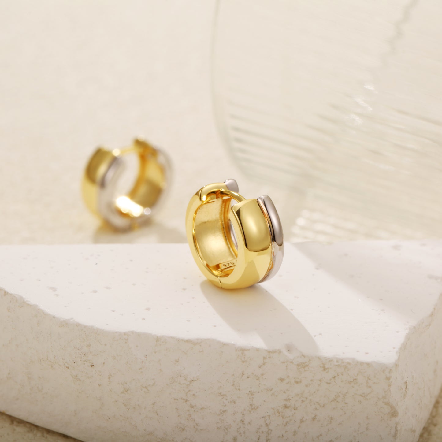 Two-tone gold vermeil huggie earrings with a bold, chunky design