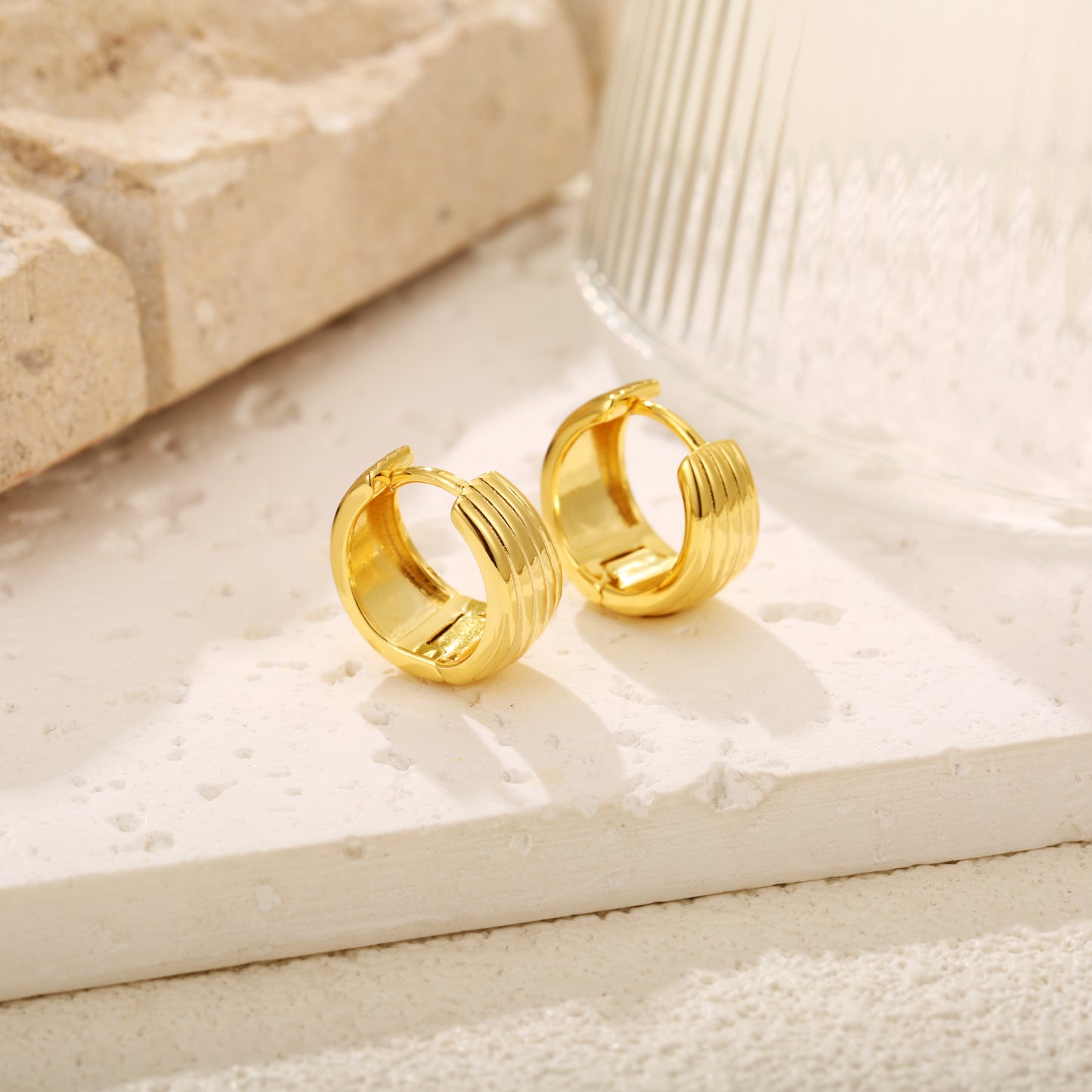 Elegant gold vermeil hoop earrings with a ribbed, layered design