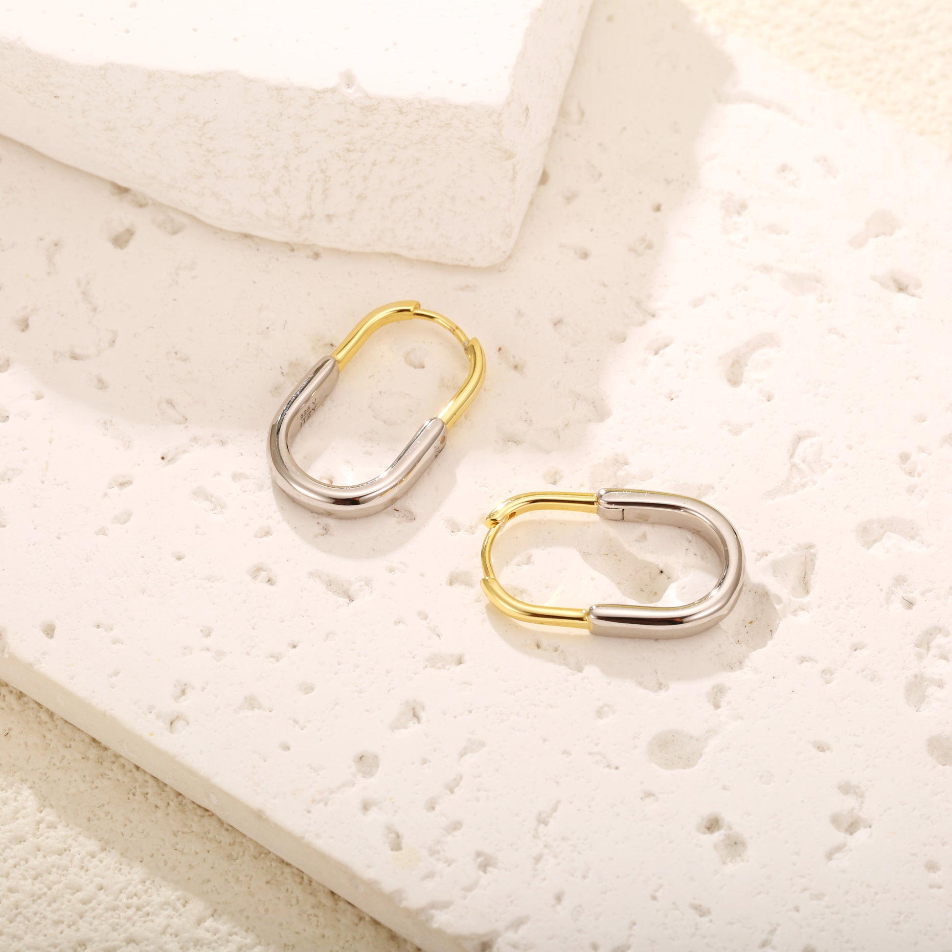 Two-tone gold vermeil hoop earrings with a sleek, modern design