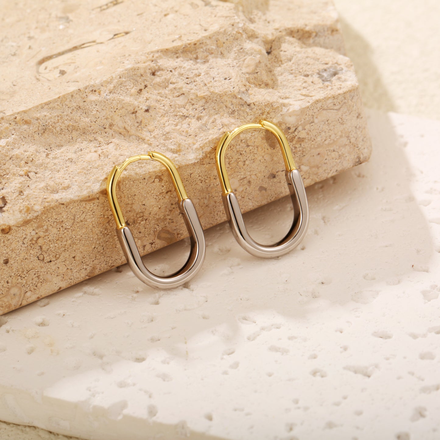 Two-tone gold vermeil hoop earrings with a sleek, modern design